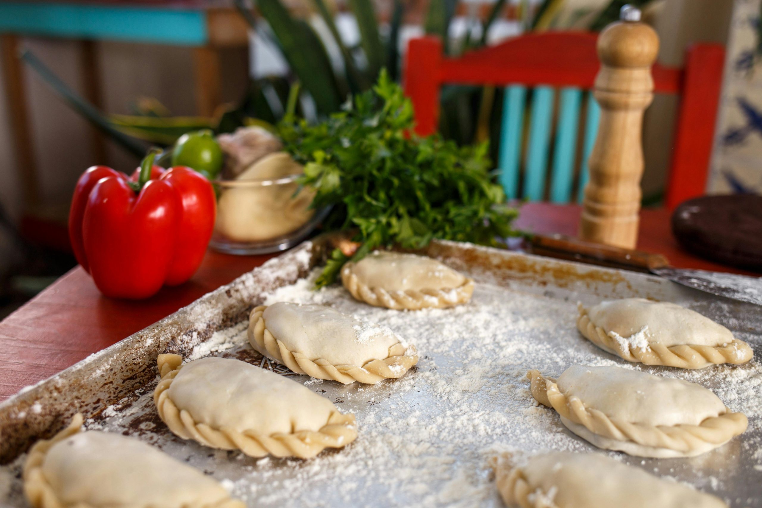 Flavorful homemade empanadas ready for baking with fresh ingredients.